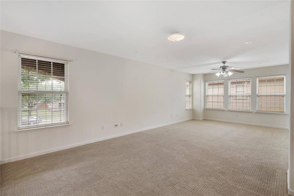 Versatile bonus room ideal for a home office, gym or a creative space, offering ample natural light.