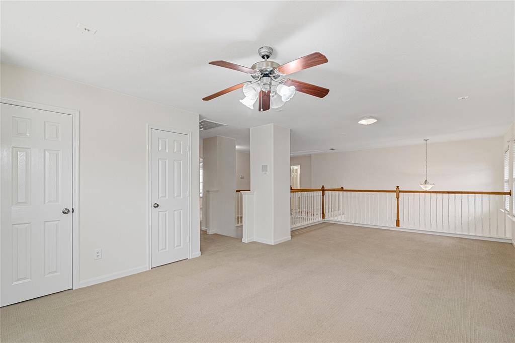 Spacious entertainment haven in this upstairs gameroom, perfect for movie nights, gaming and memorable gatherings.