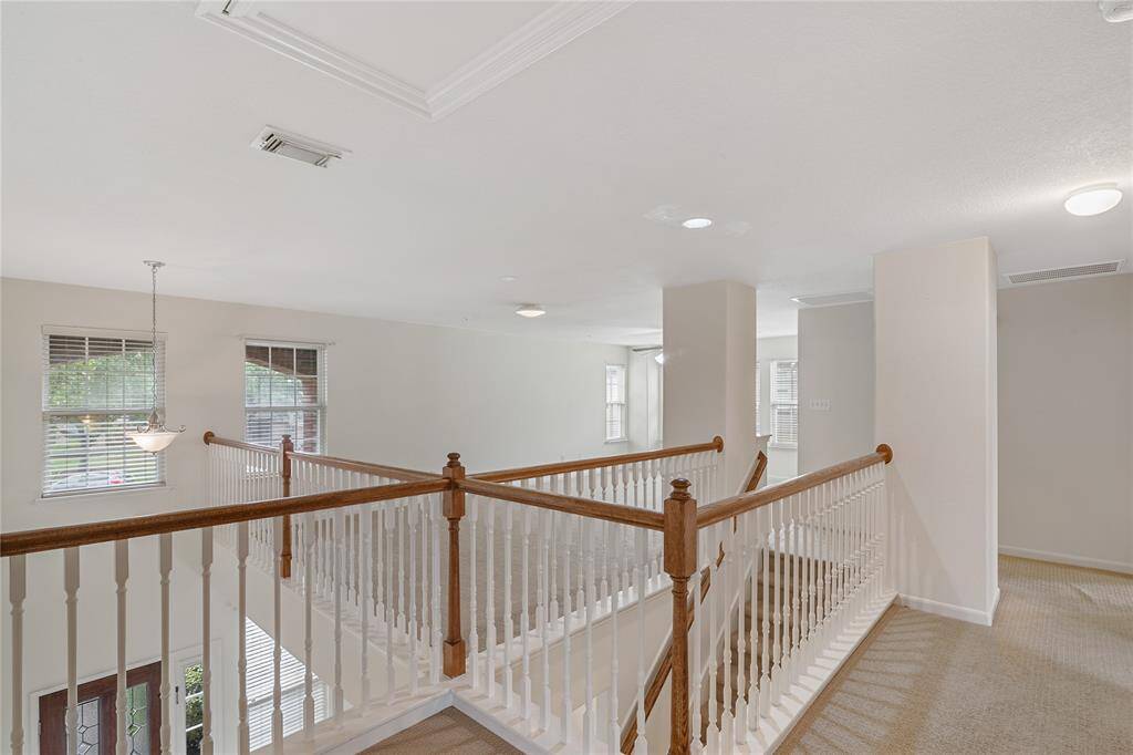Discover the central entertaiment zone of the upper level, strategically positioned by 3 cozy bedrooms for easy access and family fun.