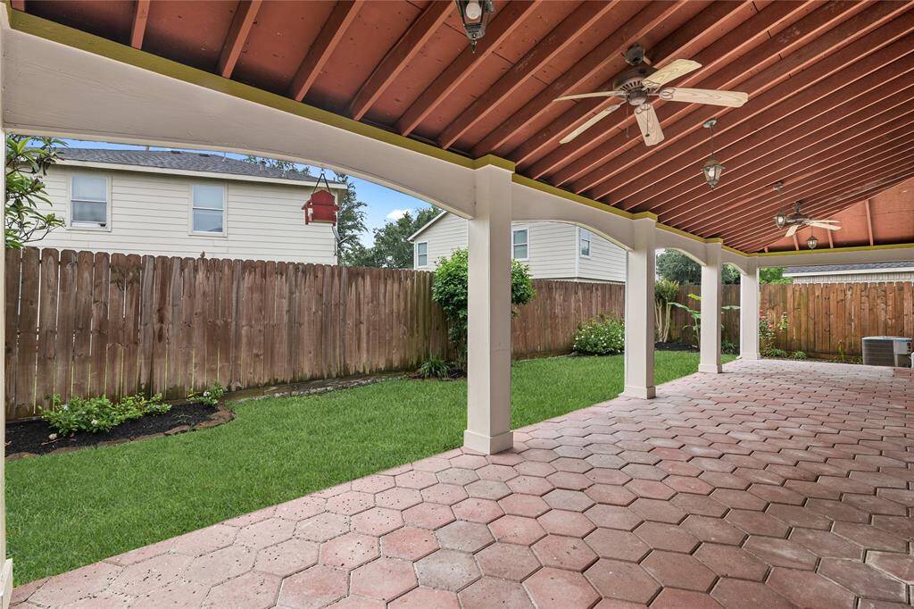 Enjoy serene relaxation on your shaded covered patio, perfect for cooling off during warm days.