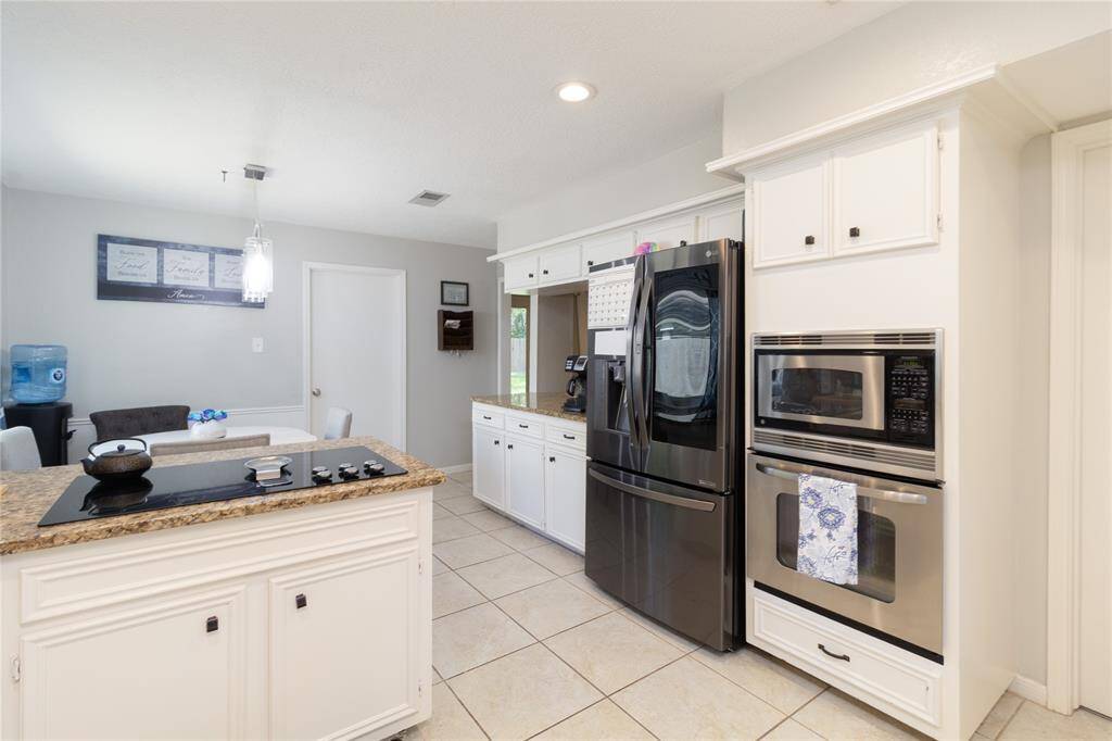 Kitchen opens to breakfast area