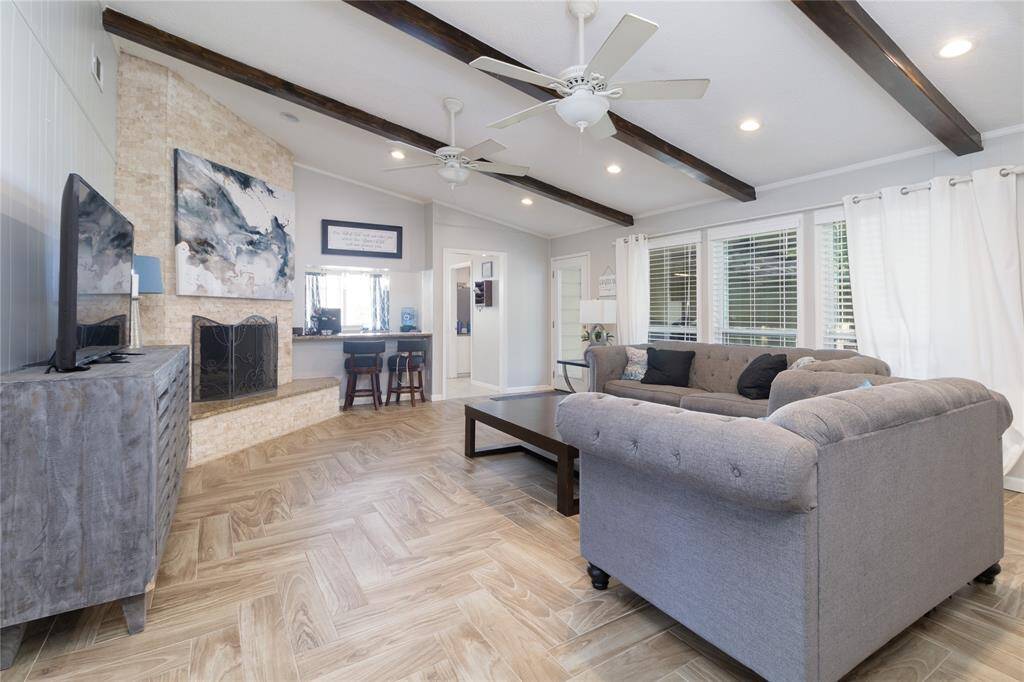 Large family room showing gas/wood burning fireplace.