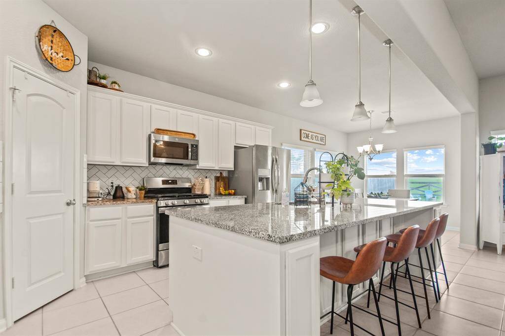 Oversized island with sink and extra seating