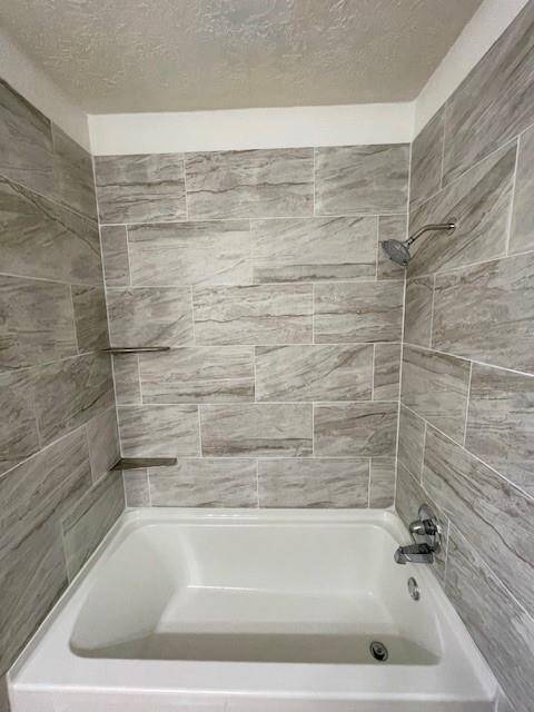 Tile walls up to ceiling.