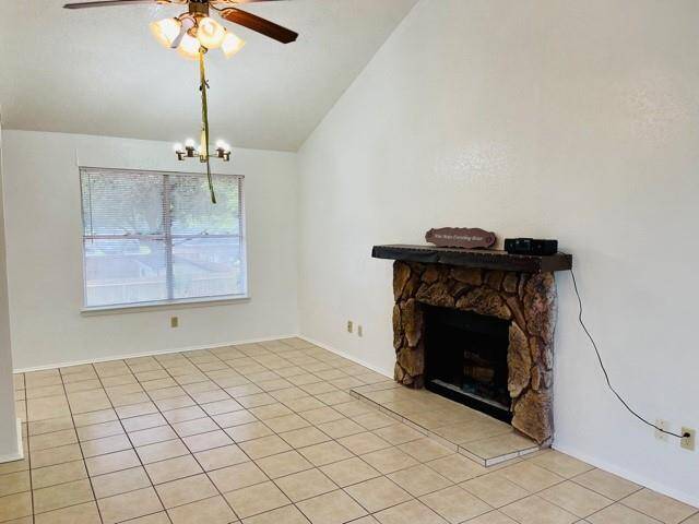 Large family room has Fireplace and big windows.