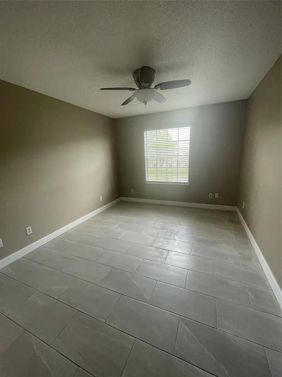 Enjoy comfort and style with a ceiling fan in the primary bedroom.