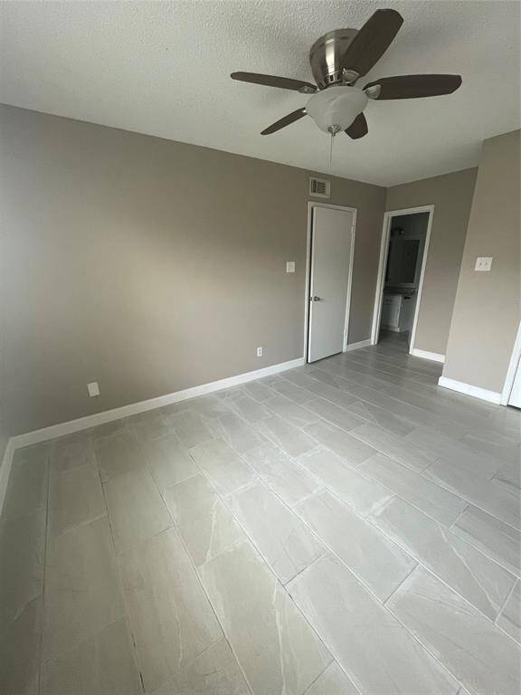 Spacious primary bedroom with an expansive walk-in closet.