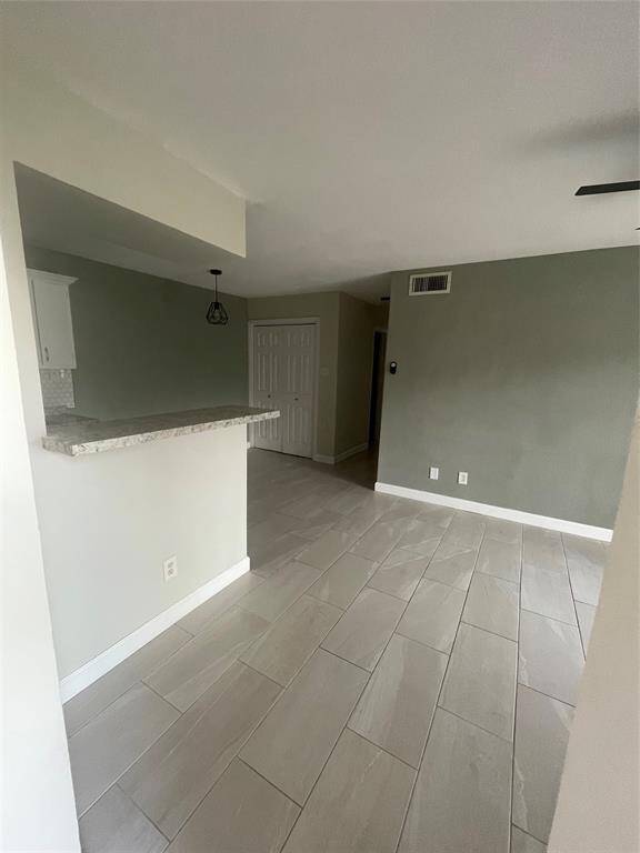 Welcome home to stunning tile floors and freshly painted walls, offering a modern and inviting first impression.