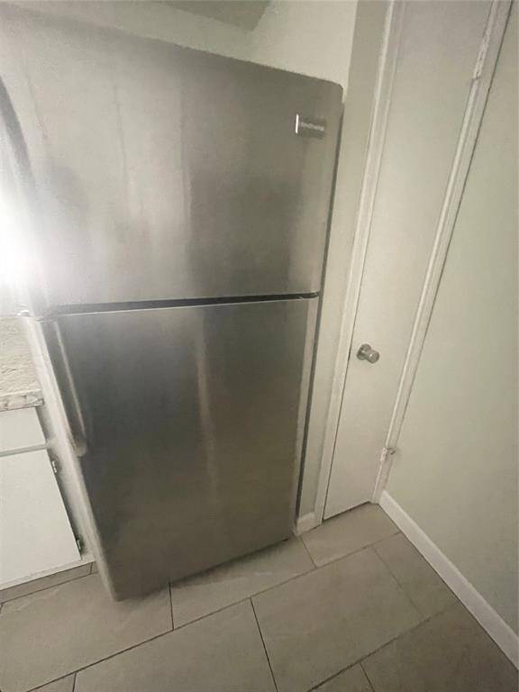 This modern stainless steel refrigerator adds style and convenience.