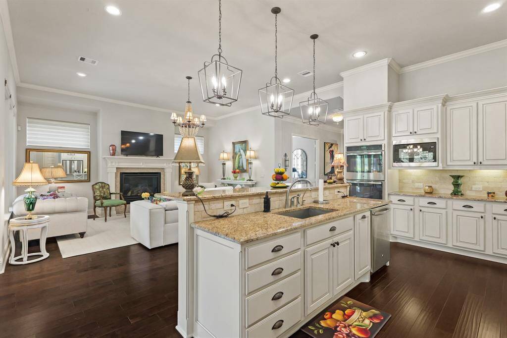 There are double ovens , microwave and dishwasher, all stainless, which are well located for serving and clearing.