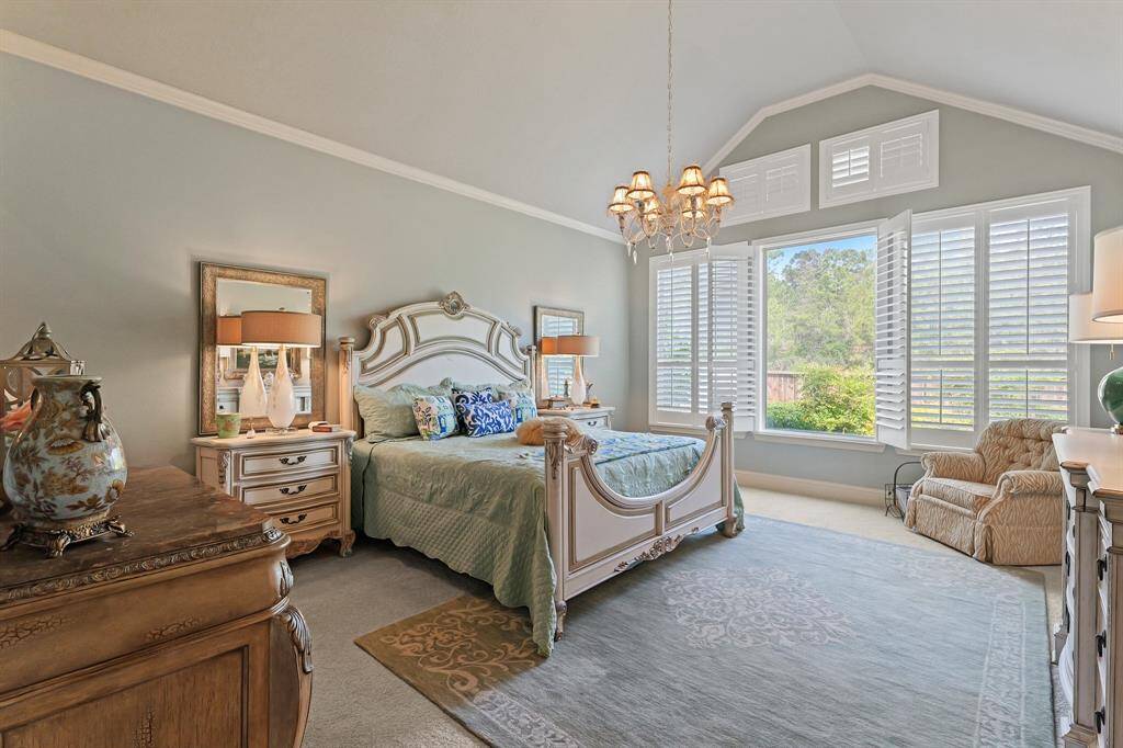 The primary bedroom is huge with fabulous windows to the back yard. There are no neighbors behind. It also offers a high ceiling.