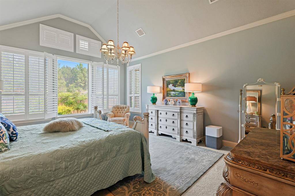 Accented by crown molding and soft neutral colors. Note the view through the window.