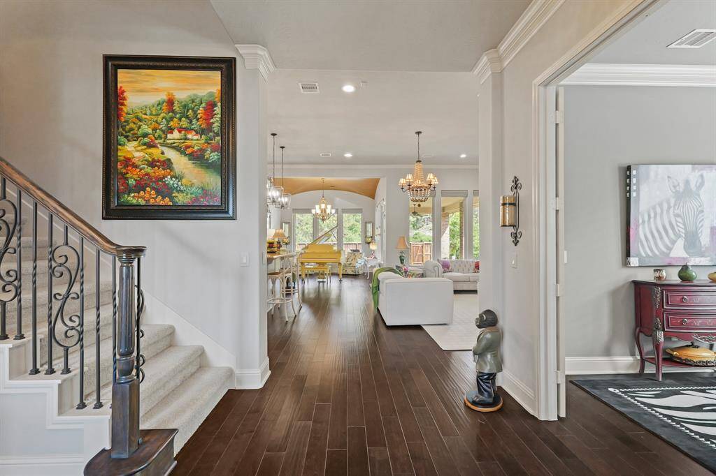 Entry is anchored by spectacular hardwood floors leading to the main living area and kitchen. Great open concept.