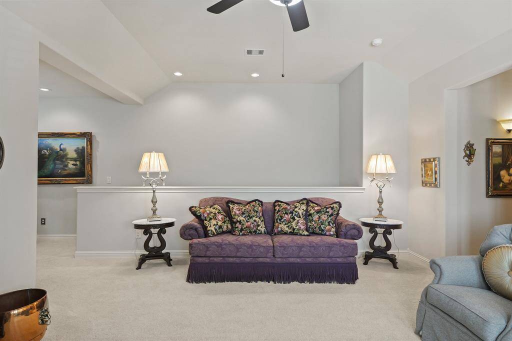 The half wall is part of the stair well leading to the game room.