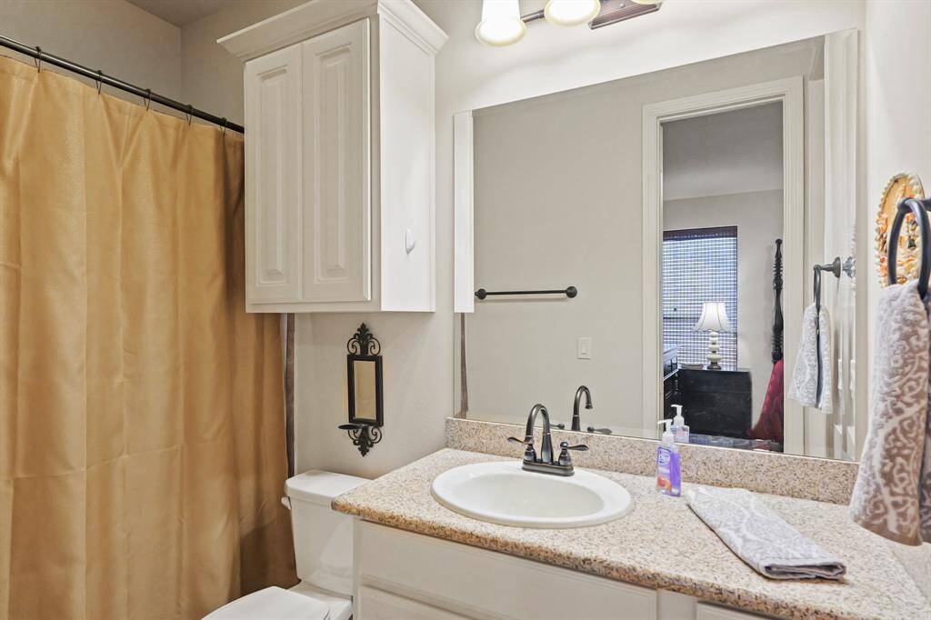 Full bath with shower tub combo.