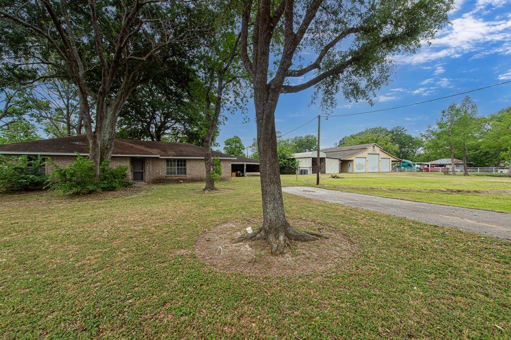 Ranch home with workshop and horse stalls.