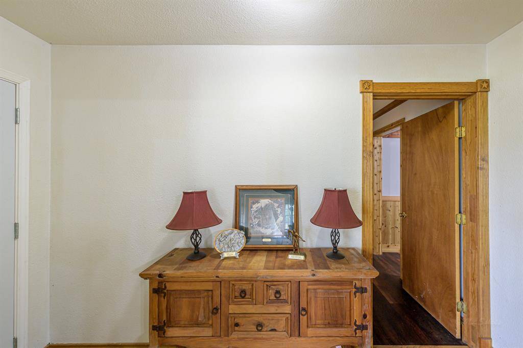 Front door opens to entry hall. All bedrooms to the left and living areas to the right.
