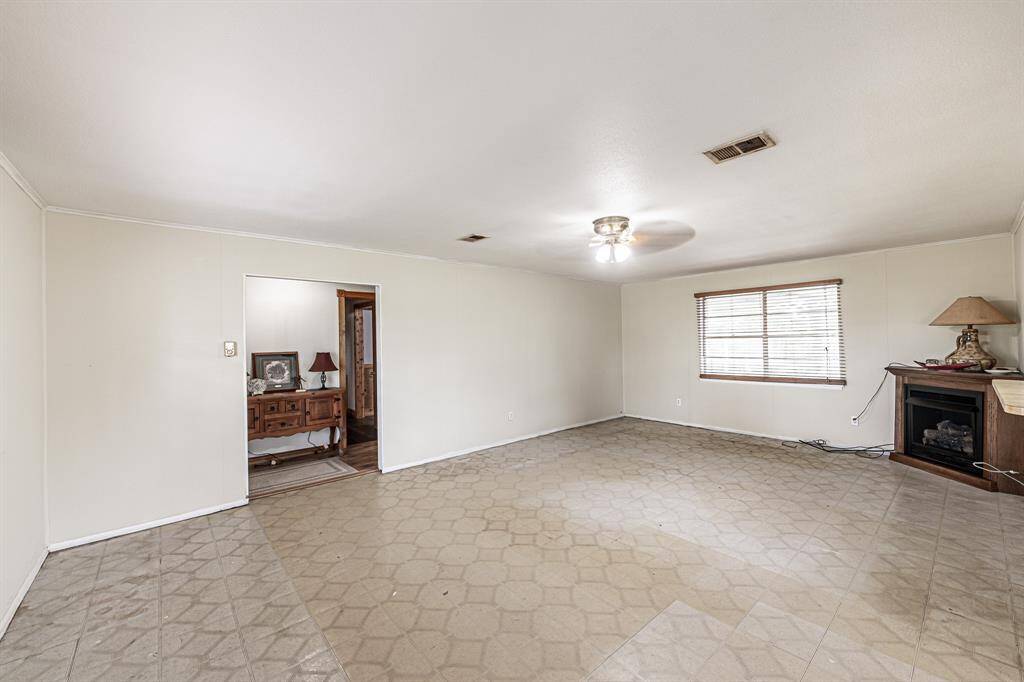 Living space with view back to entry hall.