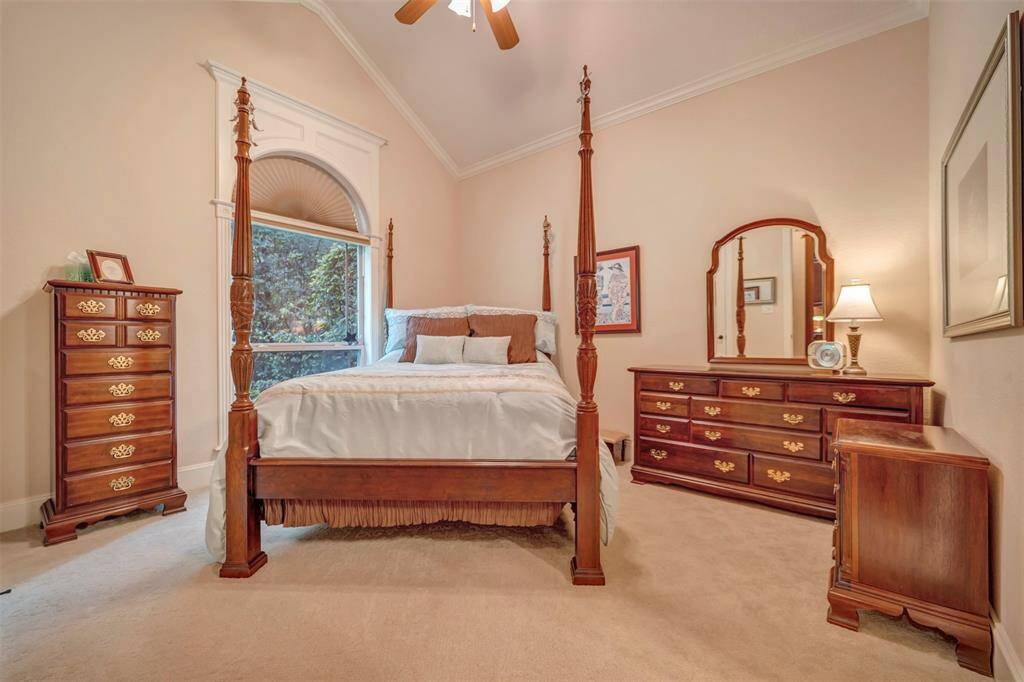 This Home office features a large Walk-In closet, Custom Built Desk station, Vaulted ceiling, Notice the crown detail and all Baseboards through out the home are 7" plus quarter round trim