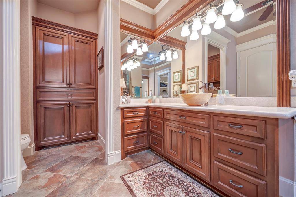 Separate His and Her High Vanity areas with wonderful Drawer and Base Cabinetry, 19" Tile flooring, Large Tiled Walk-in Spa Shower