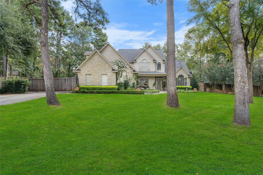 Extended driveway offers plenty of room for parking! Impeccable landscaping with driveway AND garage gate!