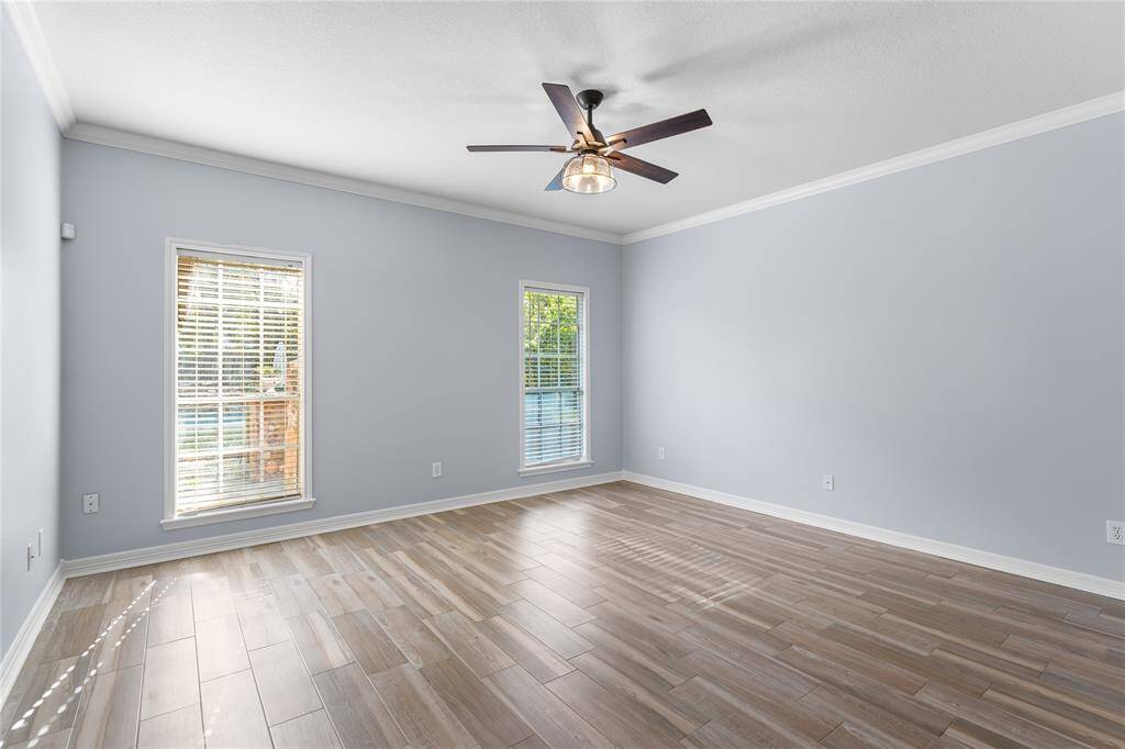 Another view of the primary bedroom with views of the pool!