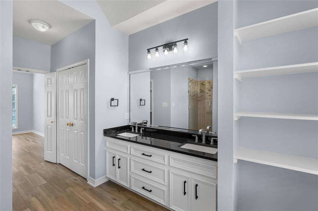 Primary bathroom with a dual sinks, two closets and built ins!