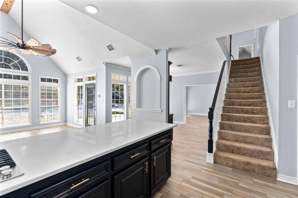 Open and bright with tons of space!  Staircase to the side providing access to second floor.  Half bath located nearby for easy guest access.
