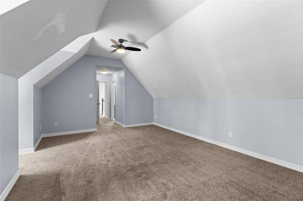 Flex room upstairs makes a great game room, gym or office with a modern ceiling fan.