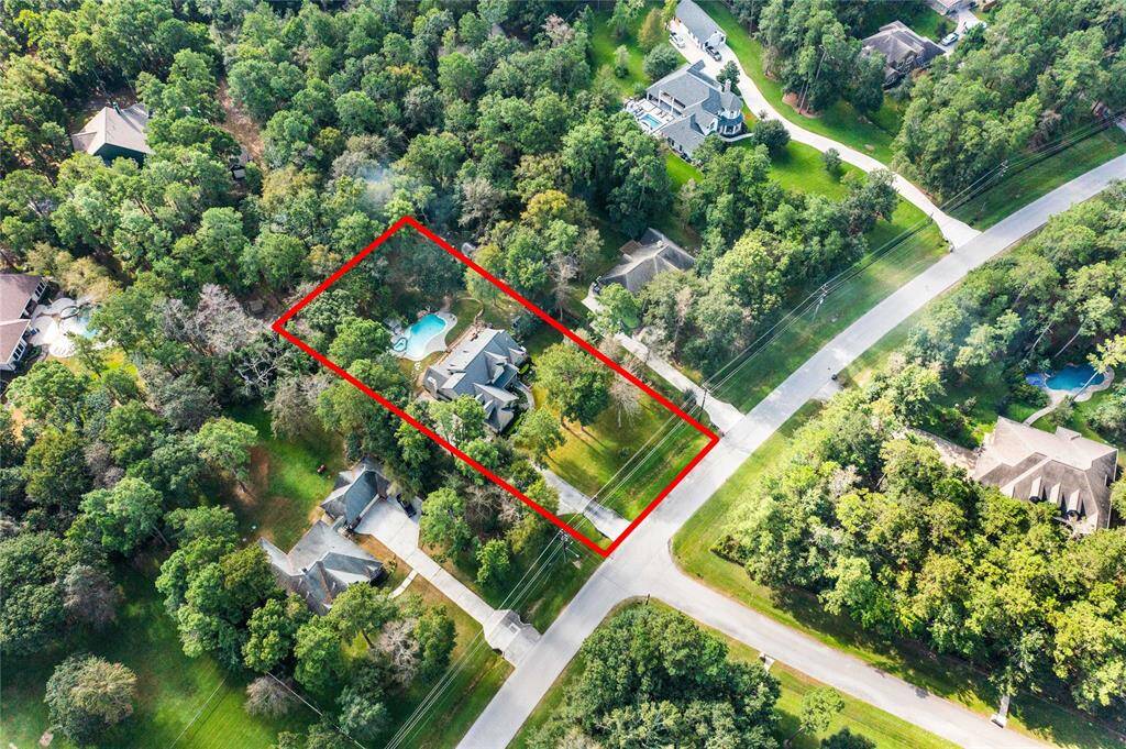 Over an acre surrounded by a lush, green, wooded area for privacy!