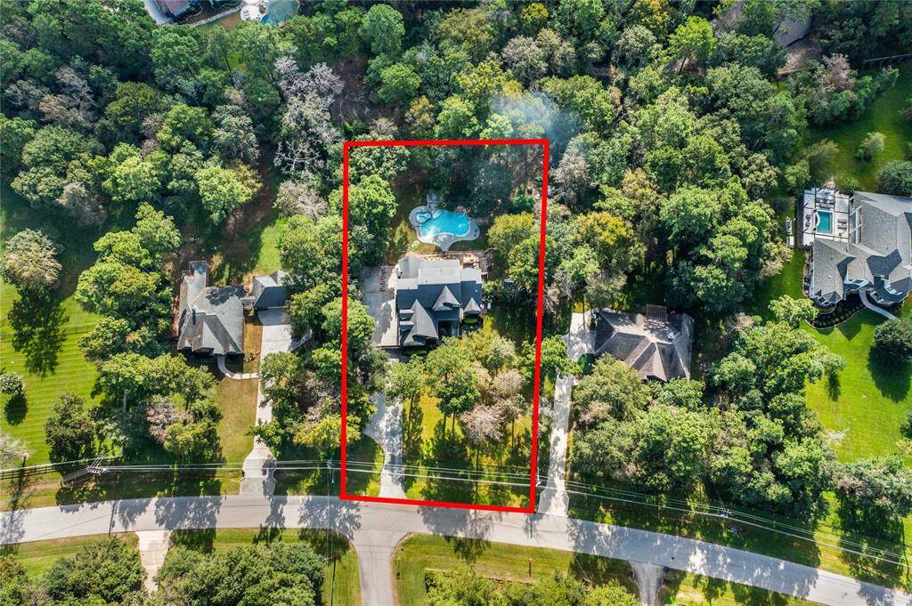 Surrounded by a lush, tree-filled yard, and oversized pool with spa!