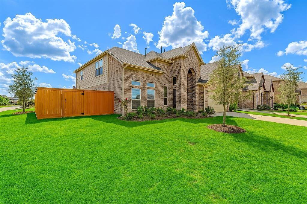 This 5-bedroom, 3-bath residence sits proudly on a large corner lot in a peaceful cul-de-sac. Beautifully landscaped and impeccably maintained, this home’s brick facade and stately entrance make a striking first impression. The lush lawn and tasteful plants frame the home perfectly, setting the stage for the exceptional interior that awaits.