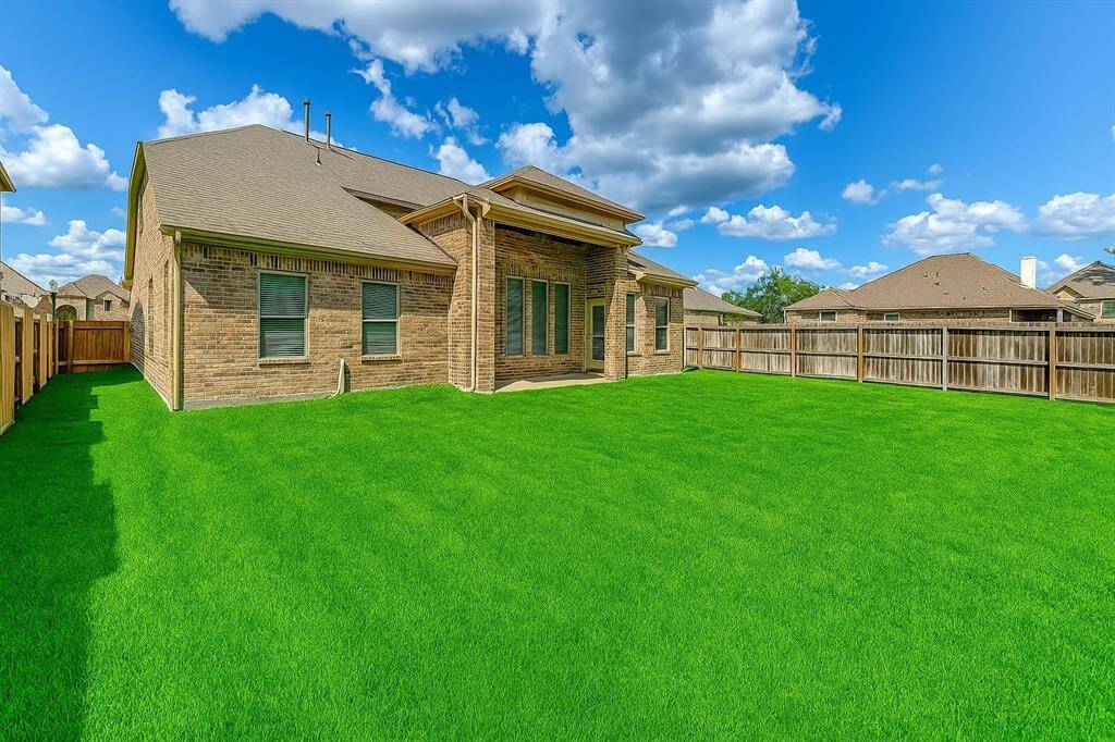 Step outside to your private retreat featuring a generous covered patio and expansive fenced yard, perfect for both relaxation and play. The patio provides an ideal spot for outdoor dining or lounging while watching the sunset. With plenty of space for gardening, pets, or even a future pool, this backyard is a true extension of your living space, ideal for enjoying warm days and star-filled evenings.