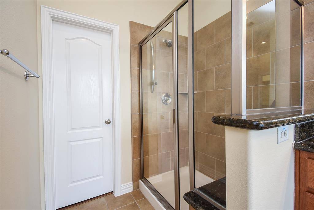 Separate shower is large with tile surround and even offers a seat / ledge.
