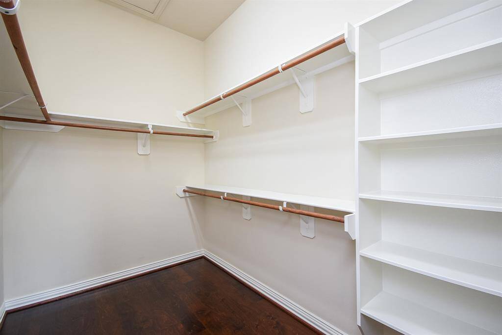 Large Primary Closet with shelving - perfect for organizing all of your clothes & shoes.