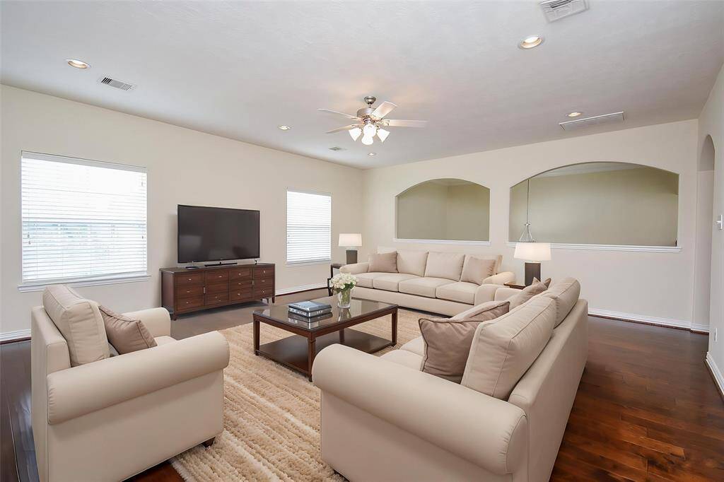 Game Room upstairs is very large with arched windows overlooking entry and arched doorways leading to other rooms. (VS)