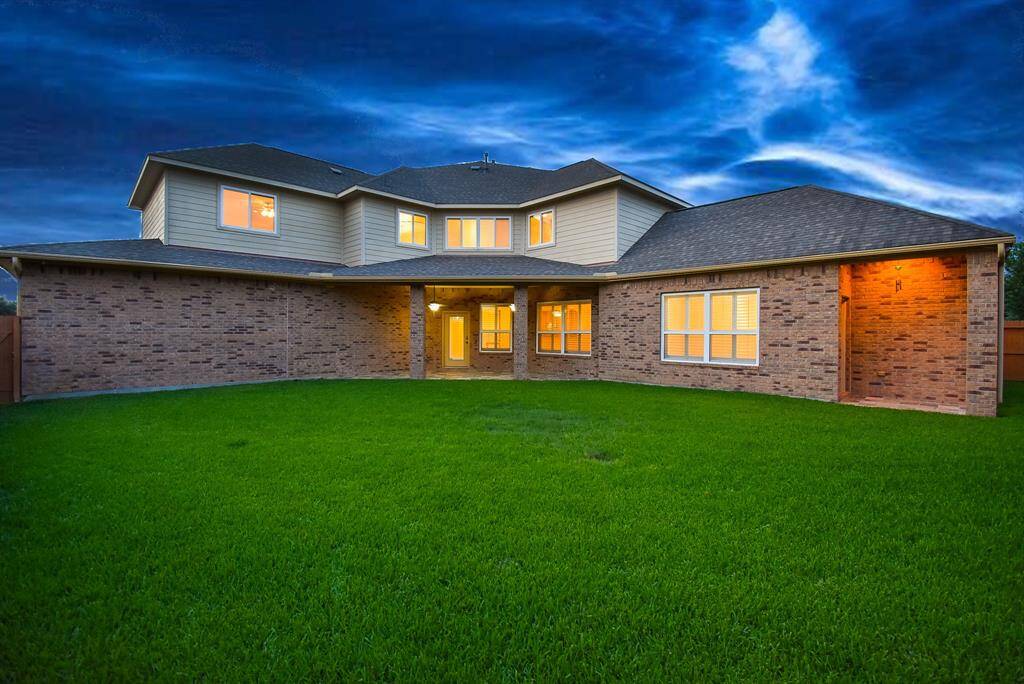 Large backyard with large covered back patio off of the Living Room and small covered patio off of the Primary Bedroom.