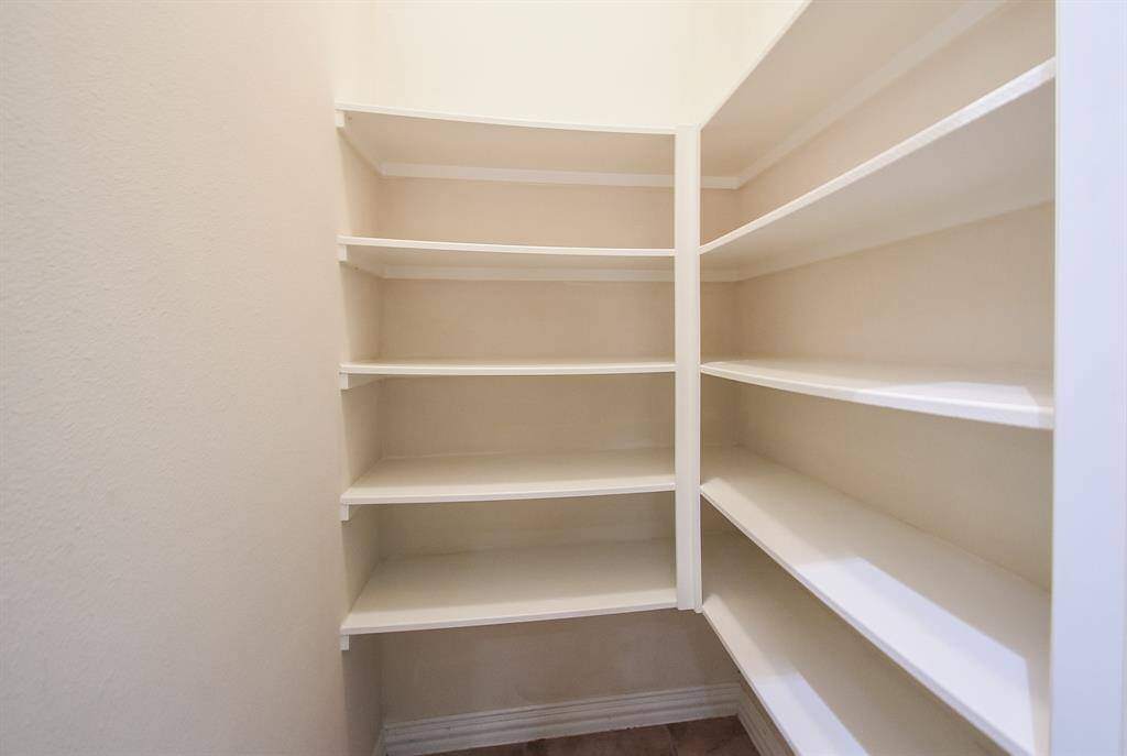 Large Pantry with plenty of shelving.