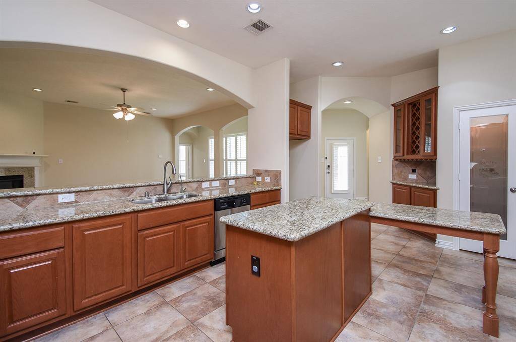 Large archway over the long breakfast bar - opens to the large Family/Living Room.