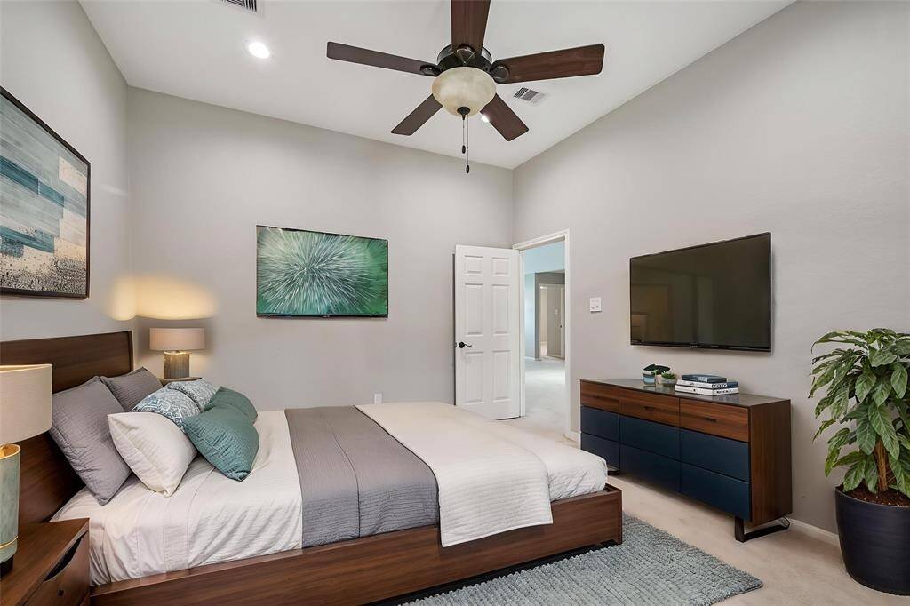 GUEST BEDROOM WITH VAULTED CEILING, AND CEILING FAN, FOR A RELAXING RETREAT. **This room has been virtually staged.