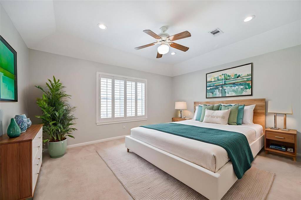 SPACIOUS BEDROOM WITH PLANTATION SHUTTERS, RECESSED LIGHTING, AND A CEILING FAN FOR COMFORT. ***This room has been virtually staged.