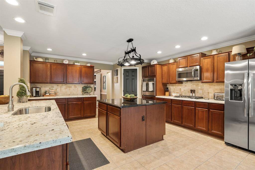 Updated granite throughout the kitchen. Refrigerator can remain with the home.