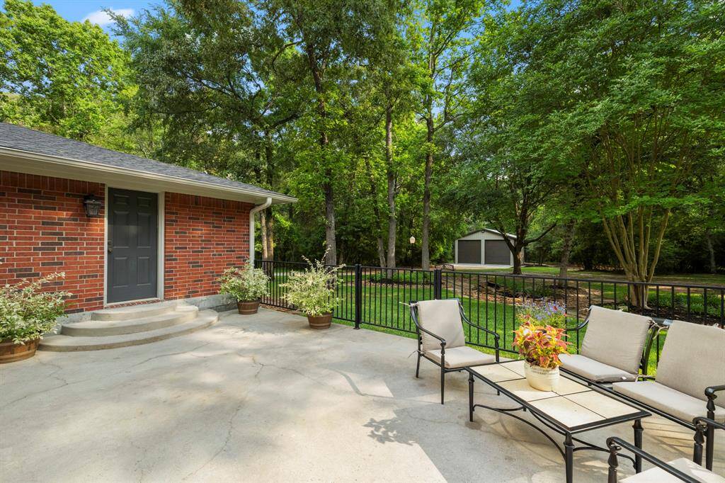 Backporch is closed in with ornamental fencing