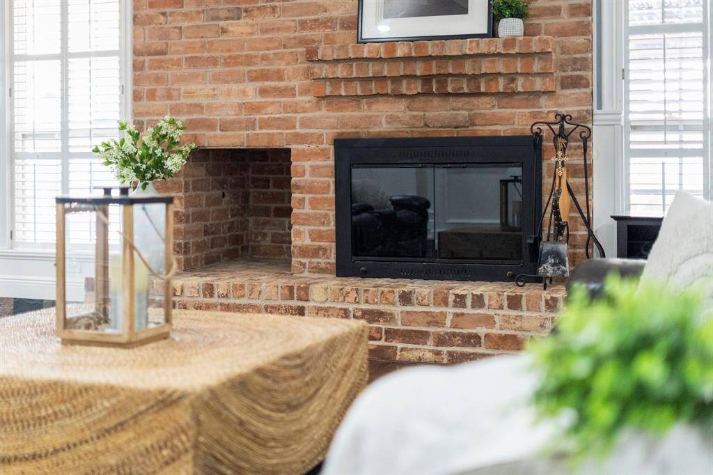 Enjoy an evening by the brick fireplace.