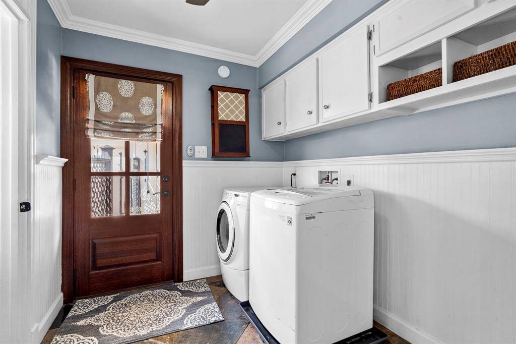 The laundry room features tile floors,washer and dryer connections, andplenty of storage space.