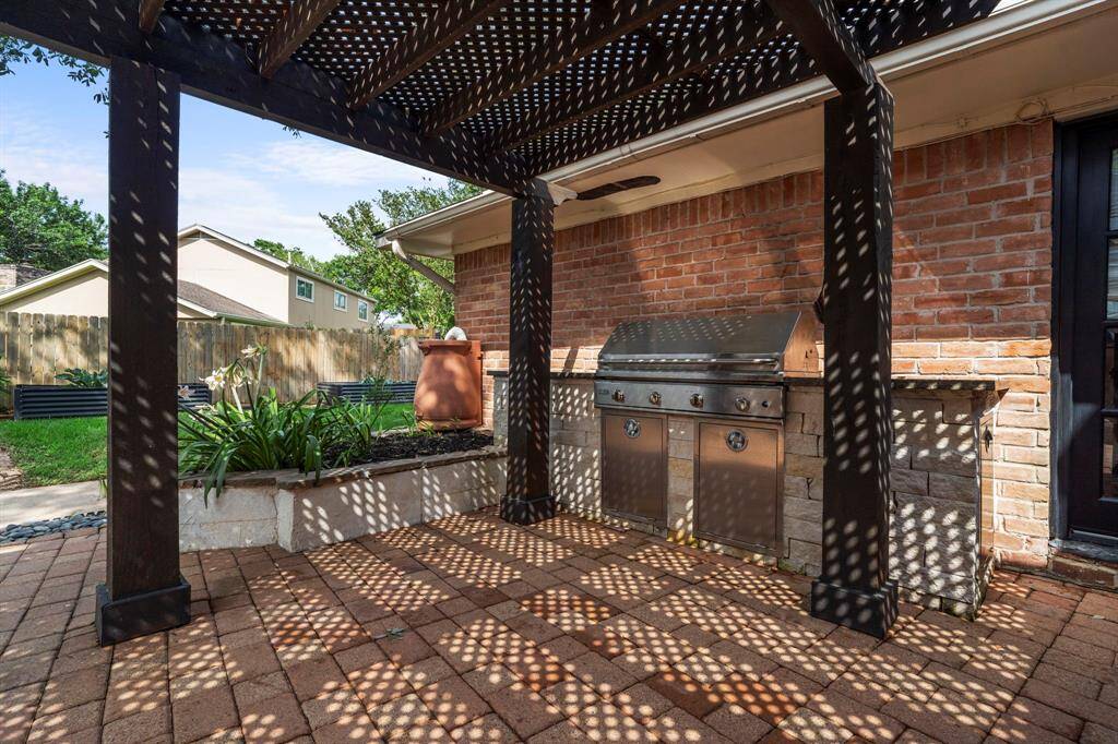 The outdoor grill area has spacious countertops.