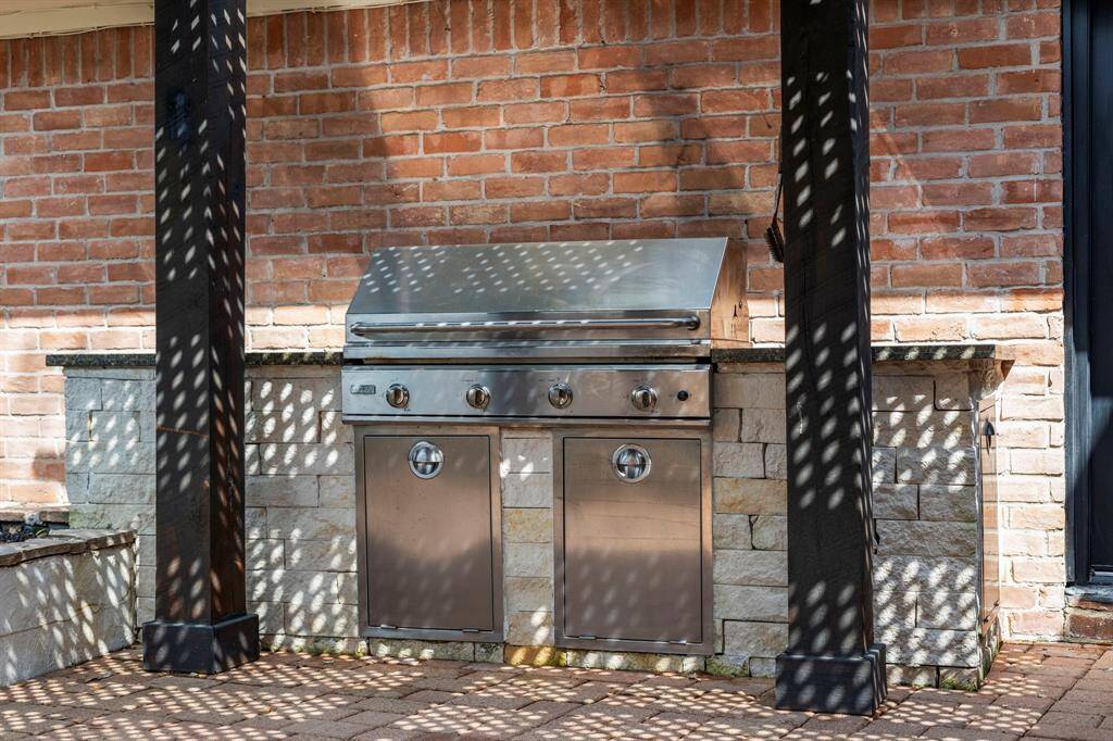 The outdoor grill area has spacious countertops.