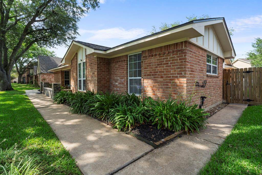 The paved walkway extends all the way around the house.