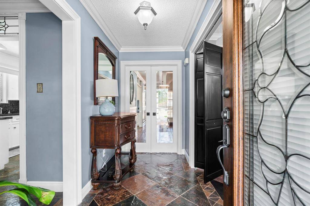 Step into luxury this home with tile floors, custom paint, and crown molding.