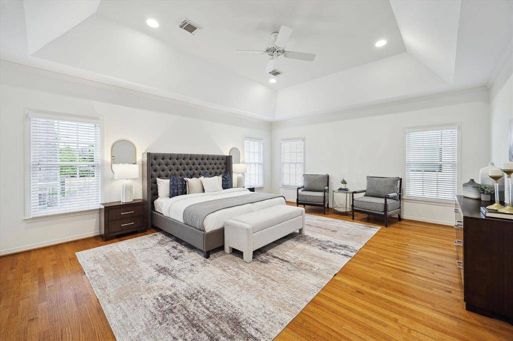 PRIMARY BEDROOM.  Spectacular vaulted ceiling in this impressive primary bedroom suite.  Note the king bed and there is still ample space in the room for extra furniture items.